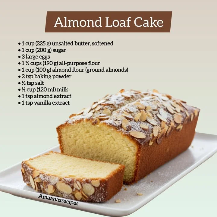 Delicious almond loaf cake on a wooden table with fresh almonds