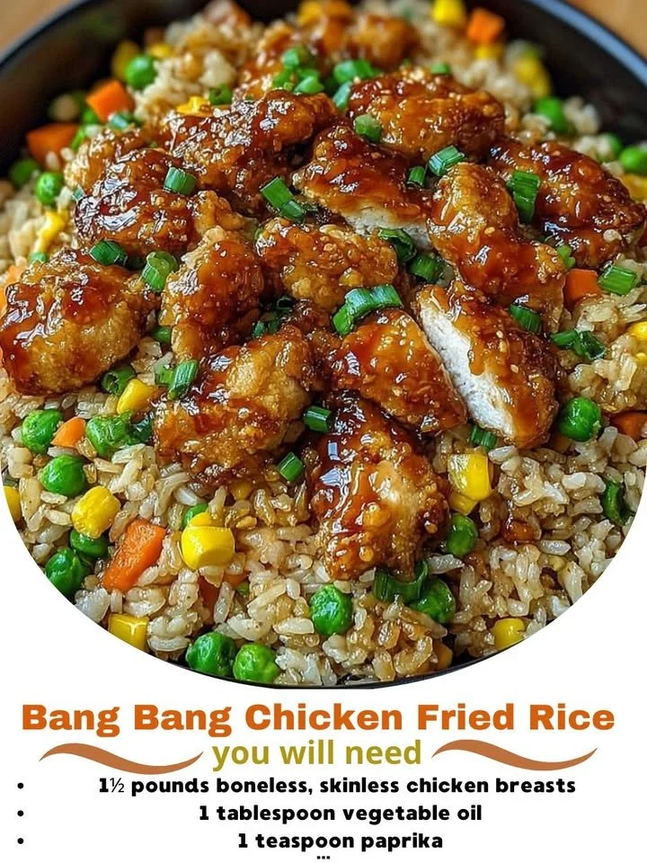 Plate of Bang Bang Chicken Fried Rice garnished with fresh herbs.