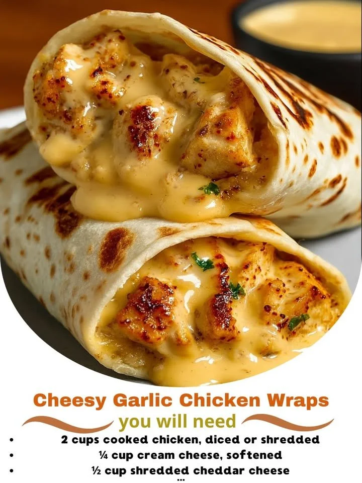 Cheesy garlic chicken wraps served on a plate with fresh herbs