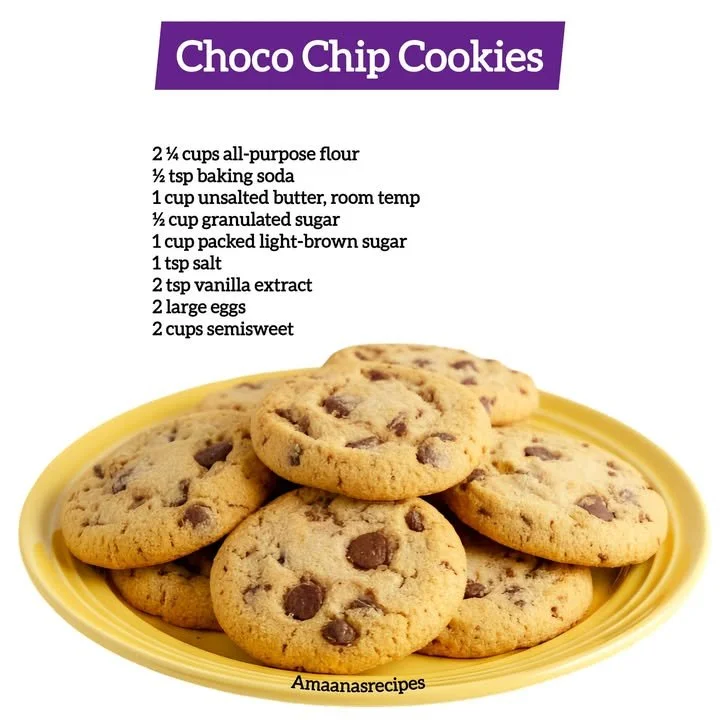 Freshly baked choco chip cookies on a cooling rack.