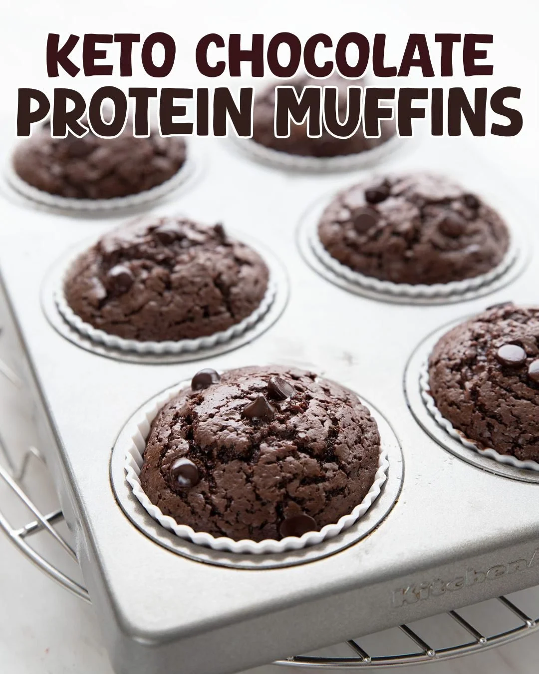 Delicious chocolate protein muffins topped with chocolate drizzle.