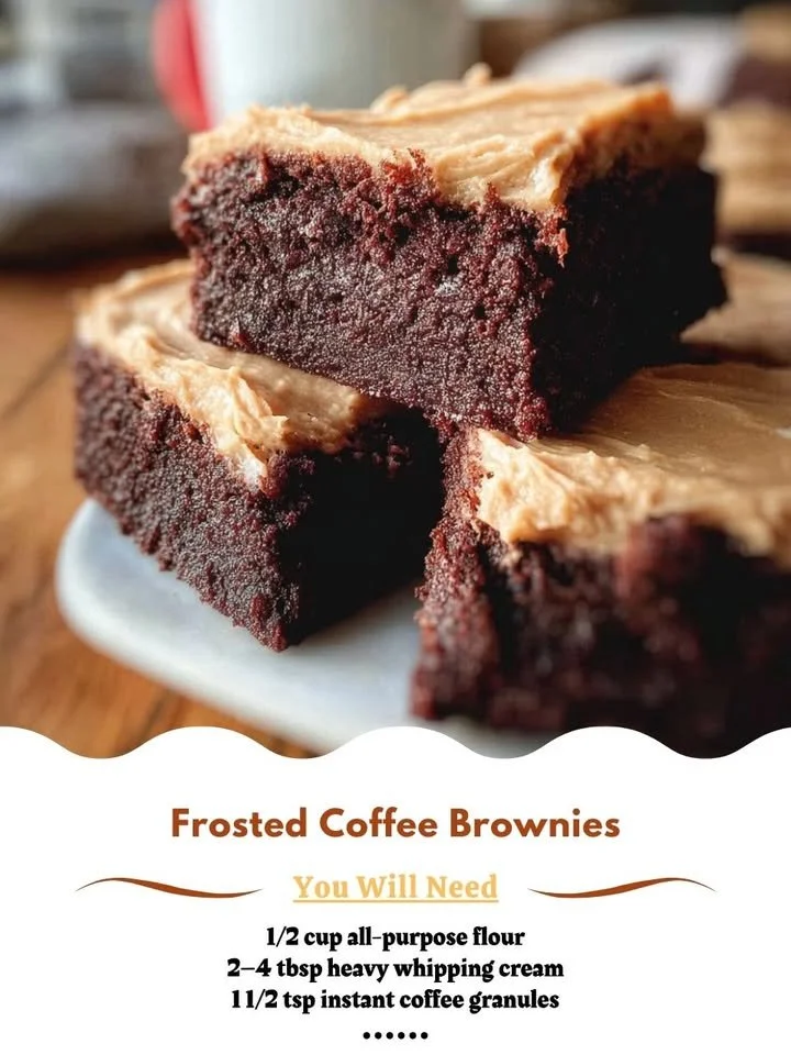 Delicious frosted coffee brownies topped with creamy frosting on a plate.