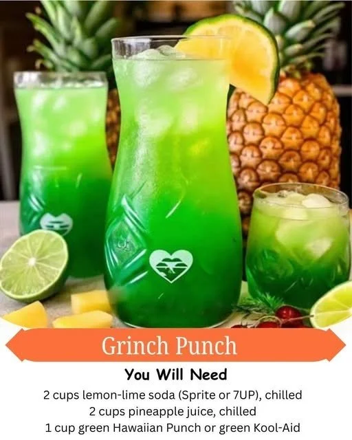 Festive Grinch Punch in a holiday-themed glass with garnishes