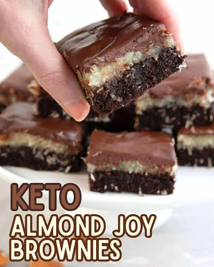 Keto Almond Joy Brownies topped with coconut and almond flakes