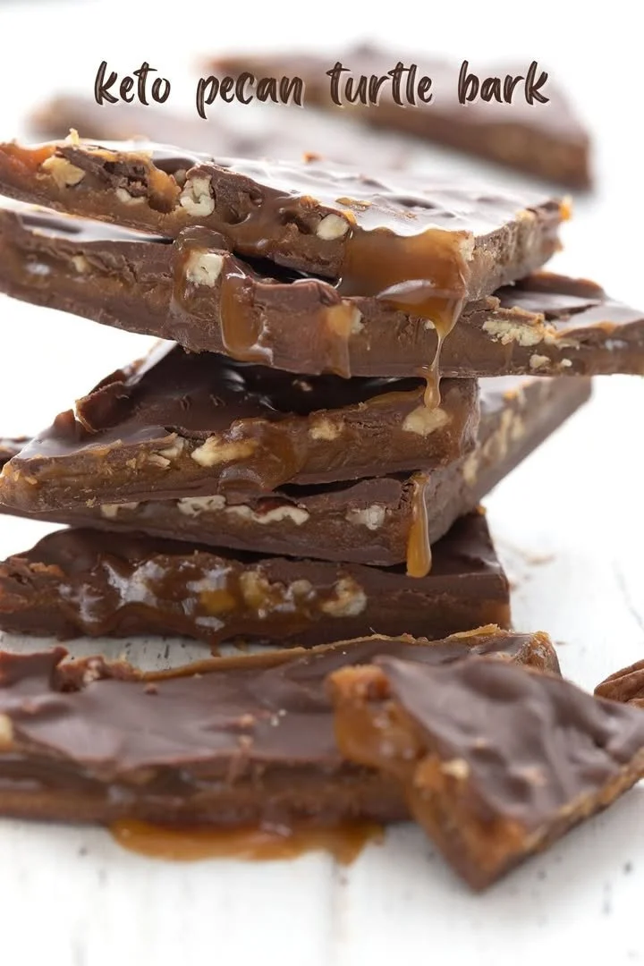 Keto Pecan Turtle Bark dessert with pecans and chocolate on a marble surface