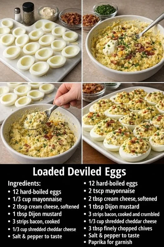 Loaded deviled eggs topped with bacon and herbs on a serving platter