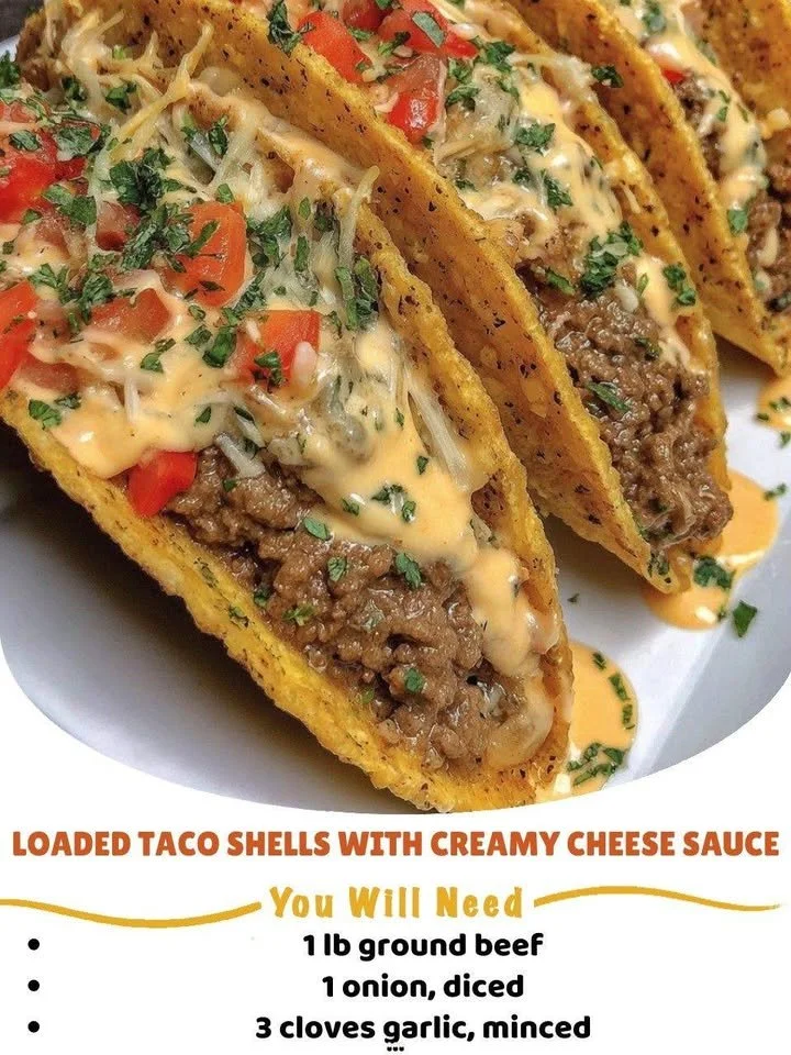 Loaded taco shells filled with toppings and creamy cheese sauce