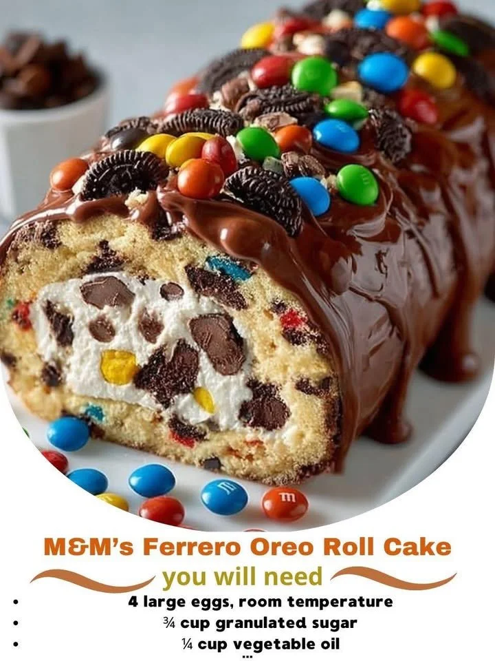 M&M’s Ferrero Oreo Roll Cake decorated with chocolate and cookies