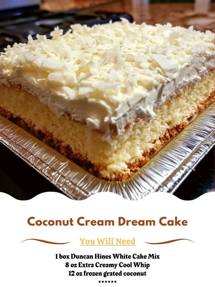 Delicious Coconut Cream Cake topped with creamy frosting and toasted coconut.