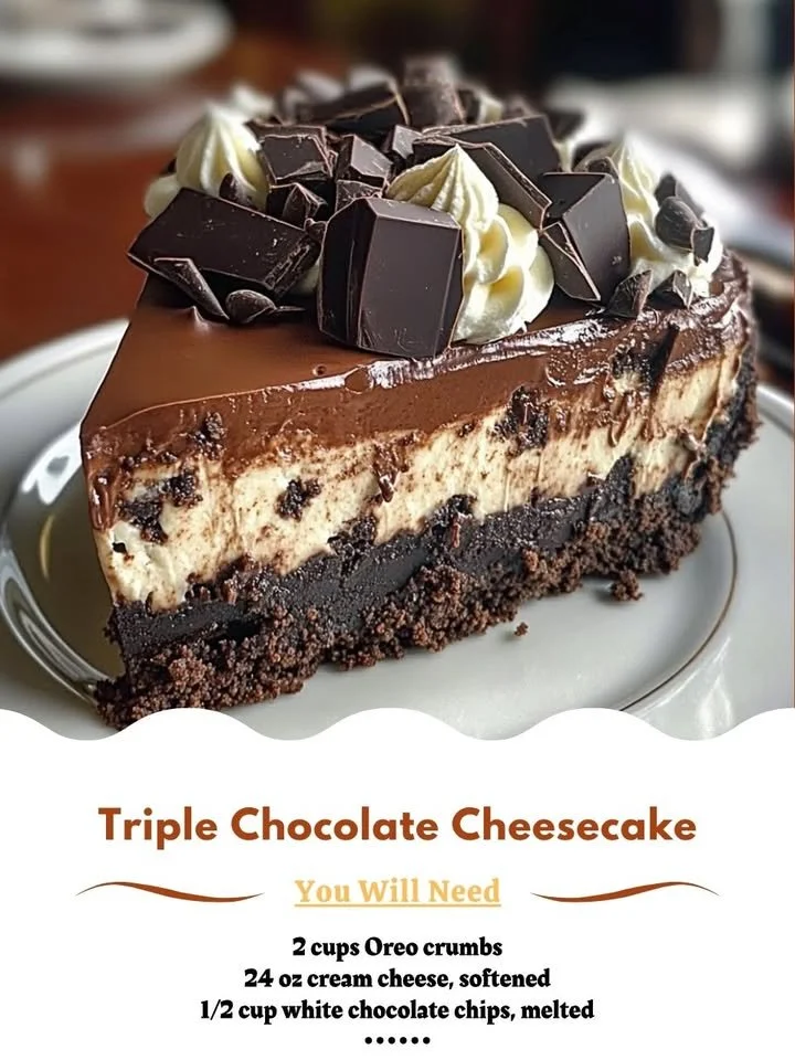 A decadent triple chocolate cheesecake topped with chocolate shavings and sauce