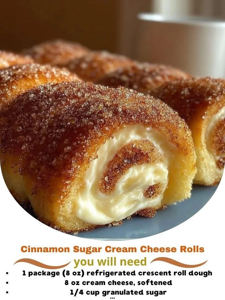 Delicious Cinnamon Sugar Cream Cheese Rolls on a plate, dusted with cinnamon sugar.