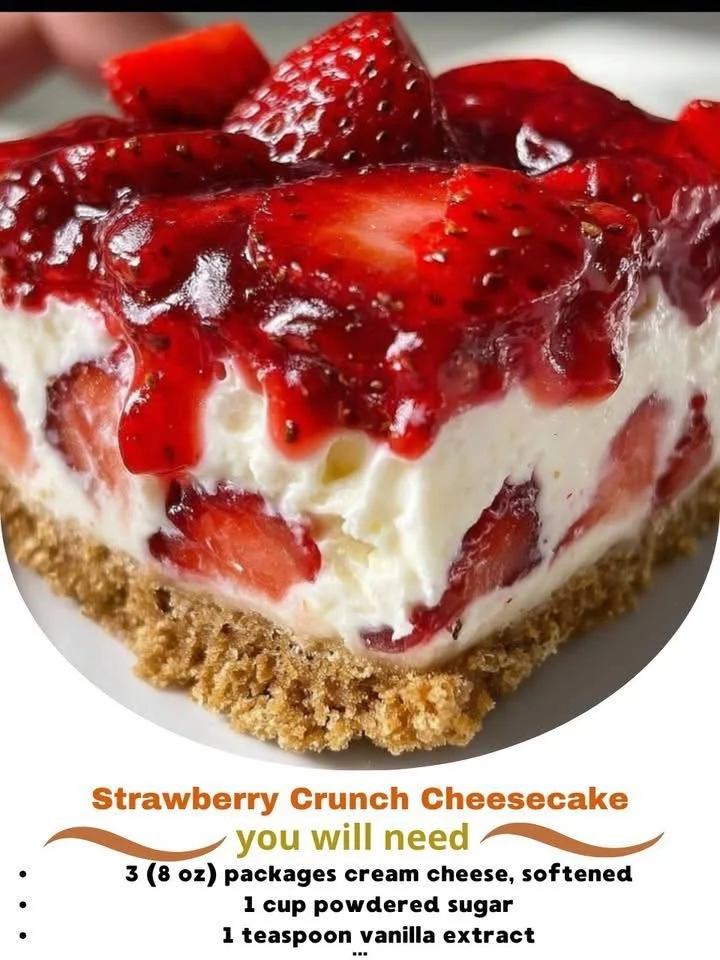 Delicious Strawberry Crunch Cheesecake topped with fresh strawberries and crust