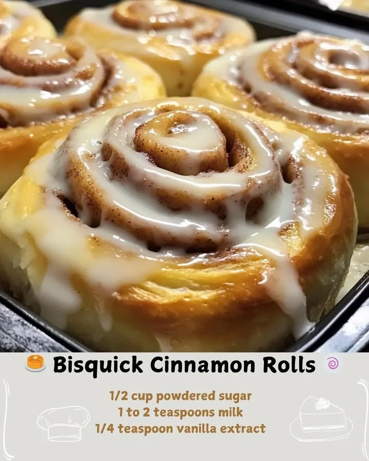 Freshly baked Bisquick cinnamon rolls topped with icing on a plate