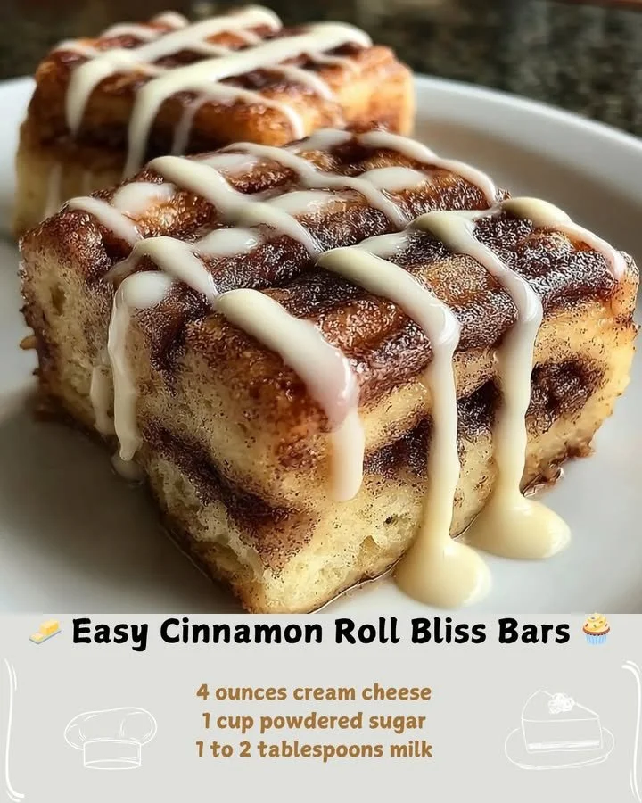Delicious homemade Cinnamon Roll Bliss Bars with creamy frosting and cinnamon swirls.