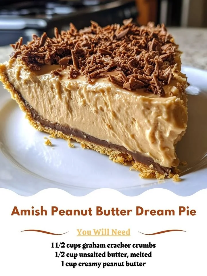 Delicious slice of Amish Peanut Butter Dream Pie topped with whipped cream.