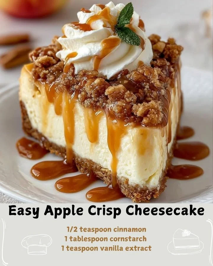 Slice of apple crisp cheesecake topped with apple slices and crunchy topping