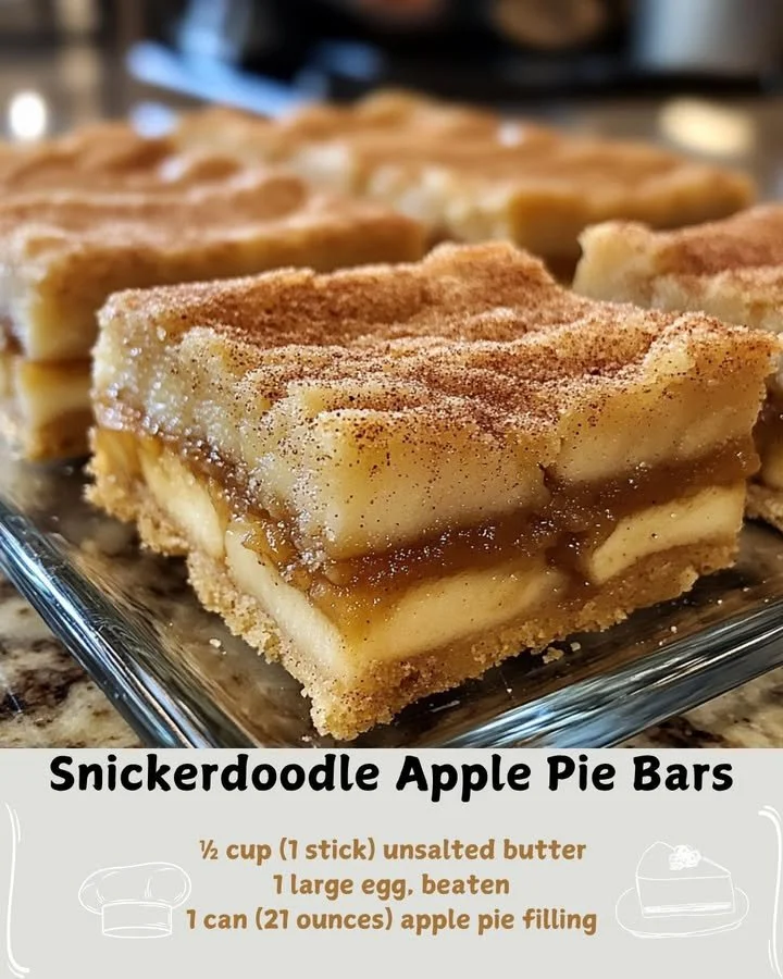 Delicious Snickerdoodle apple pie bars on a plate, showcasing their golden crust and apple filling.