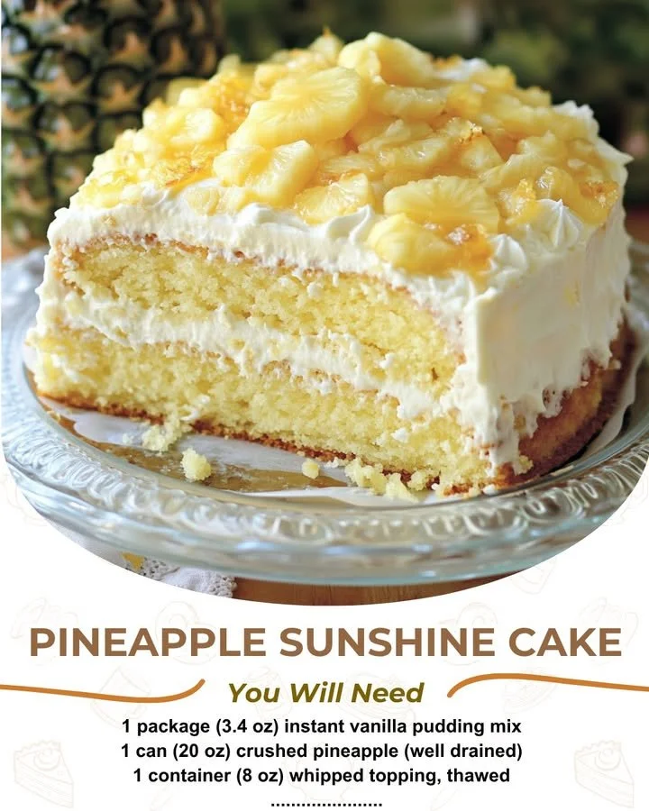 Delicious sunny pineapple cake decorated with fresh pineapple slices and cream.