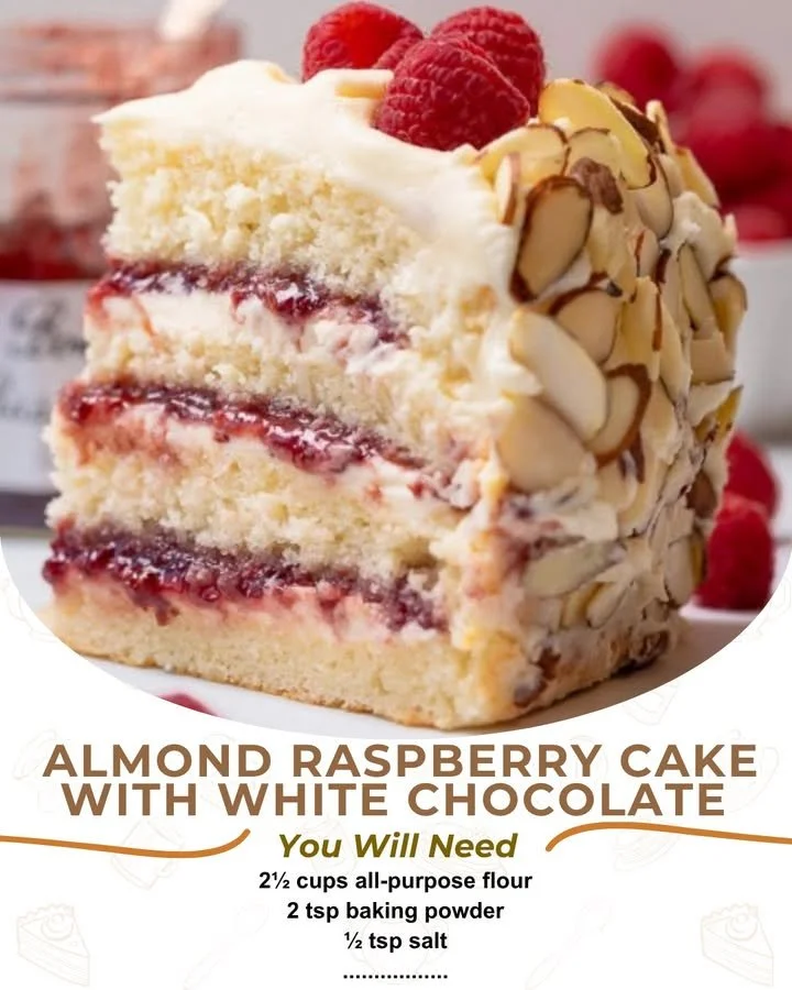 Slice of Almond Raspberry Cake with White Chocolate Amaretto Buttercream frosting