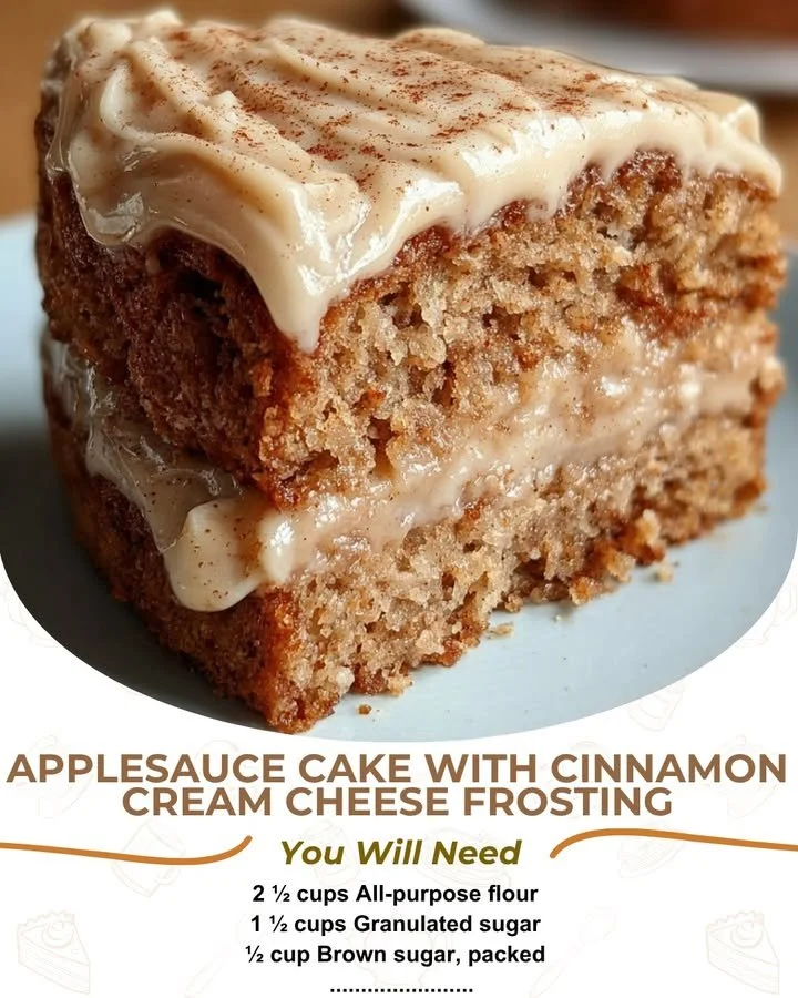 Delicious cinnamon cream cheese frosted applesauce cake on a wooden table