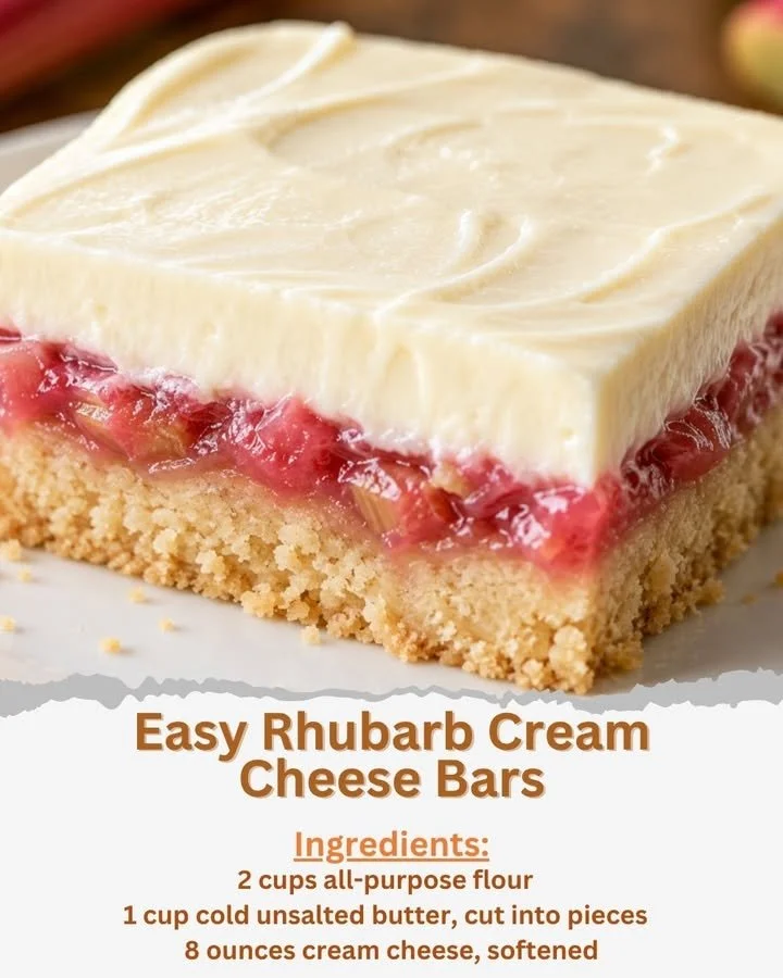 Delicious rhubarb cream cheese bars on a white plate, garnished with rhubarb.