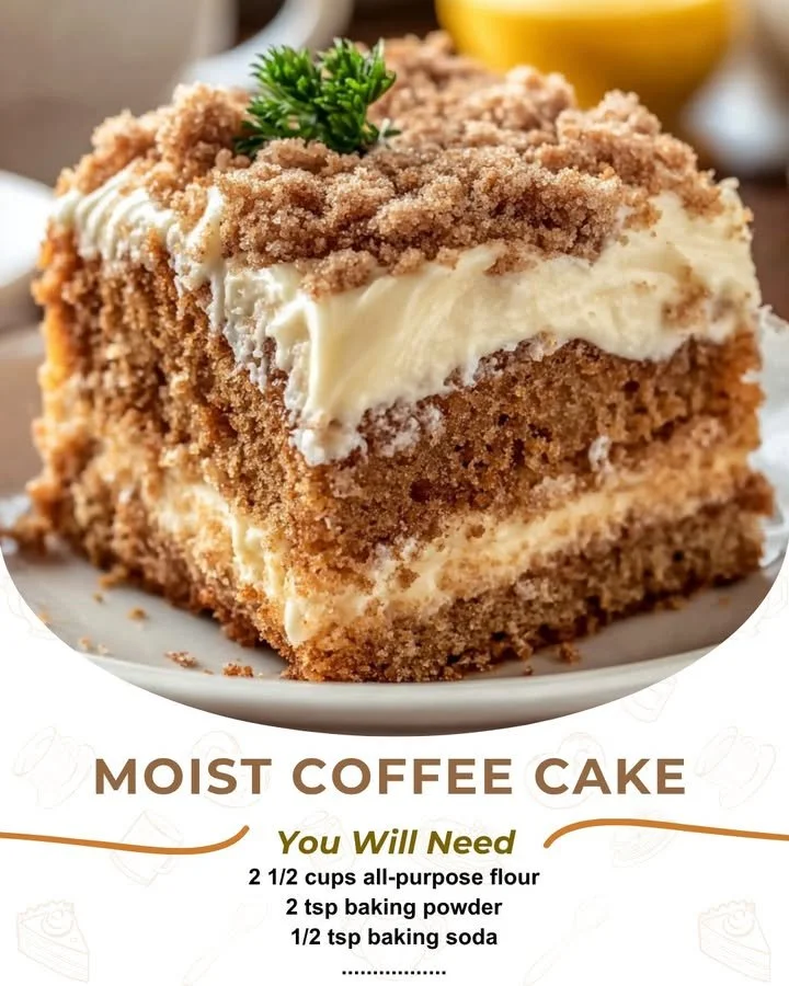 Moist coffee cake slice on a plate, topped with crumbly streusel and icing.