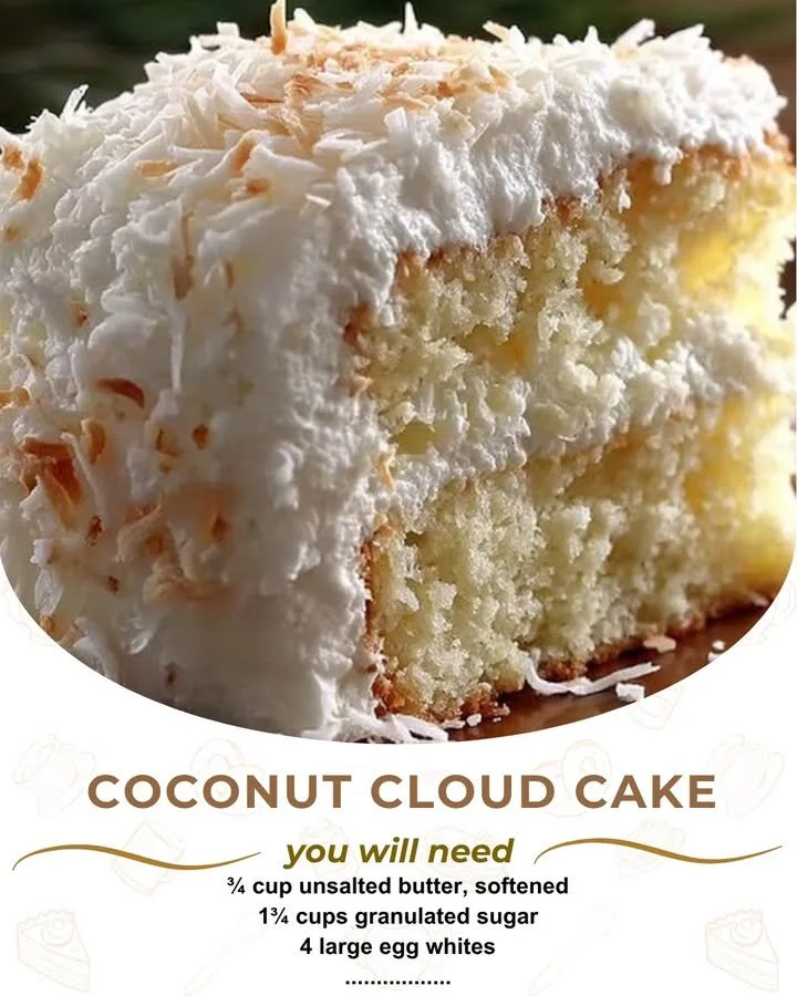Deliciously fluffy Coconut Cloud Cake topped with coconut flakes and whipped cream