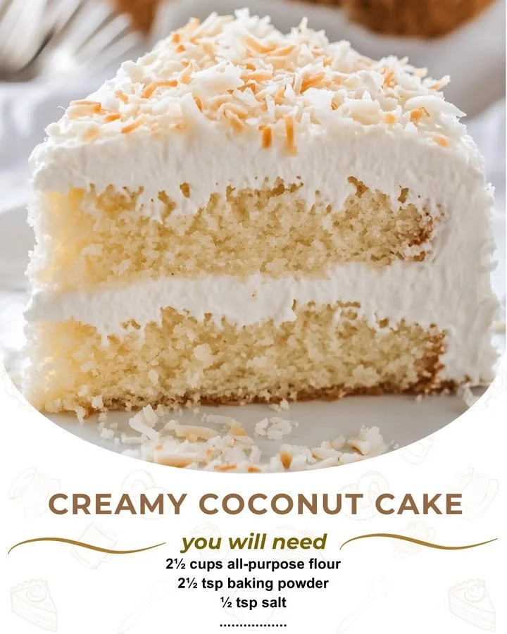 Deliciously decadent Coconut Cream Cake topped with coconut flakes and cream